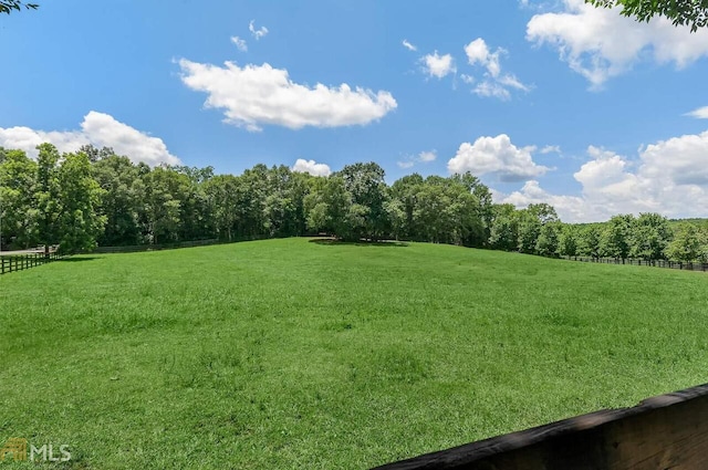 view of yard with a rural view