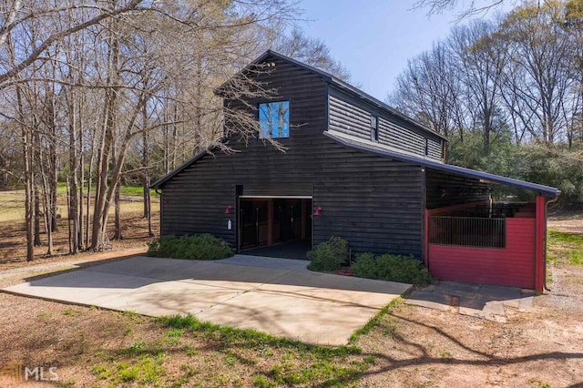 view of side of home with a garage