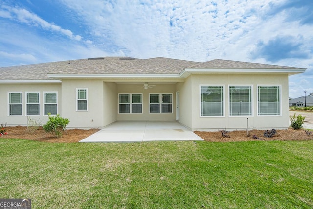 rear view of house with a lawn, ceiling fan, and a patio