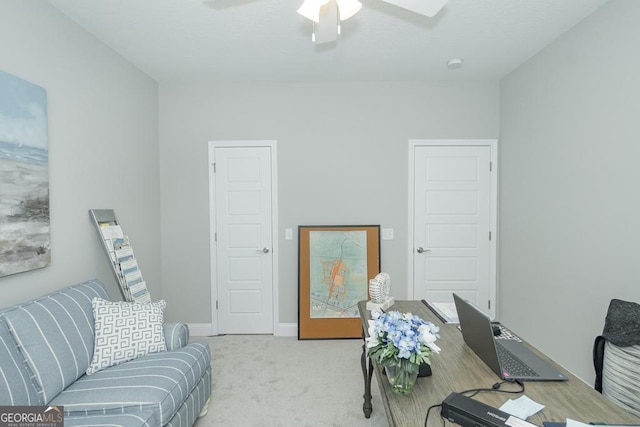 carpeted office with ceiling fan