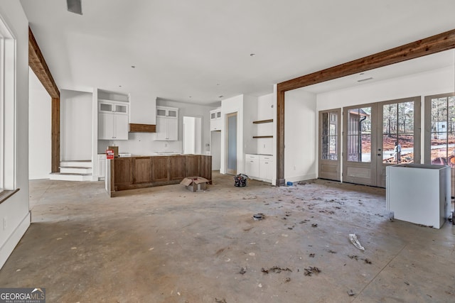 unfurnished living room with french doors