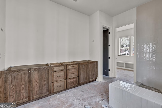 bathroom featuring concrete flooring