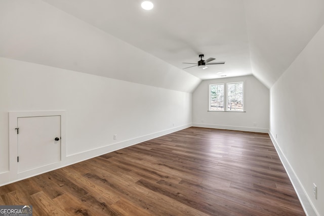 additional living space featuring vaulted ceiling