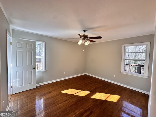 unfurnished room featuring dark hardwood / wood-style floors, ceiling fan, and ornamental molding