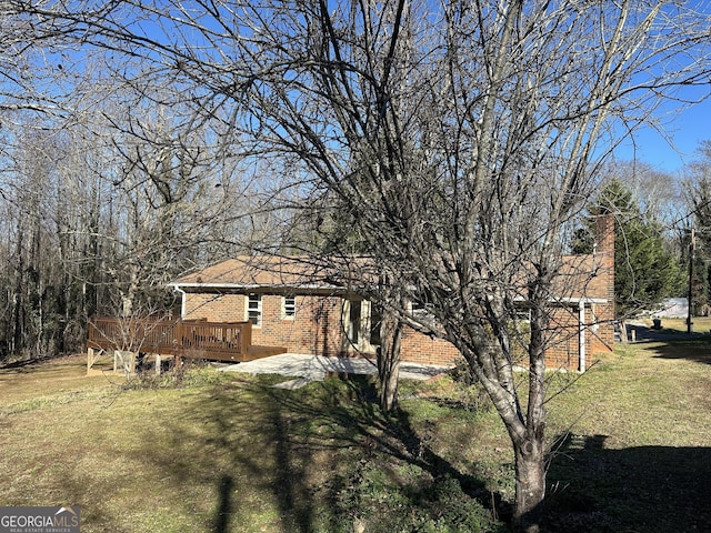 view of yard featuring a deck