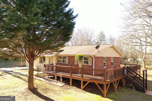 back of property featuring a wooden deck