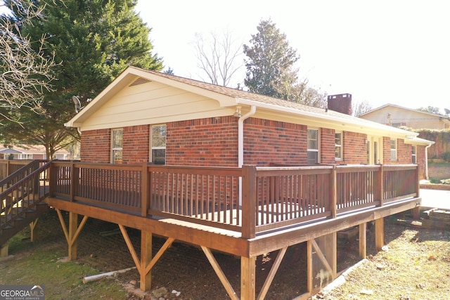 view of side of home with a deck