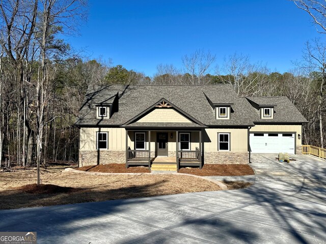 view of front of home featuring a garage and covered porch