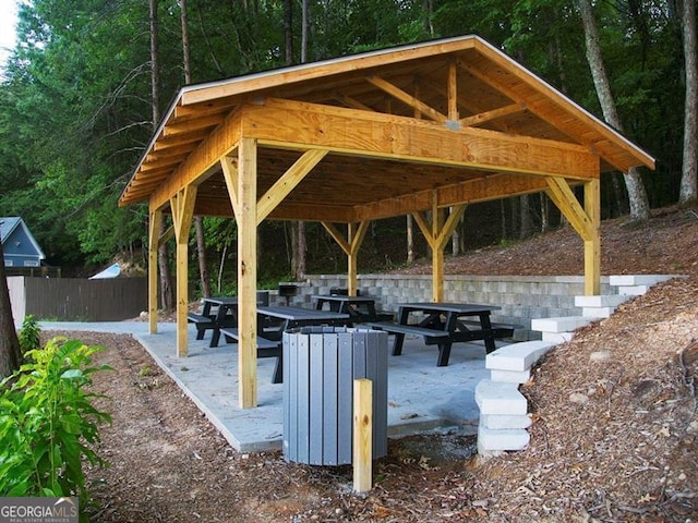 view of home's community with a gazebo, a patio area, and fence