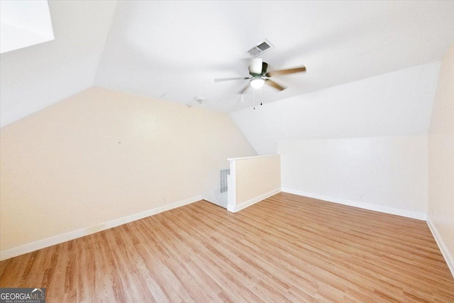 bonus room with ceiling fan, light hardwood / wood-style flooring, and lofted ceiling