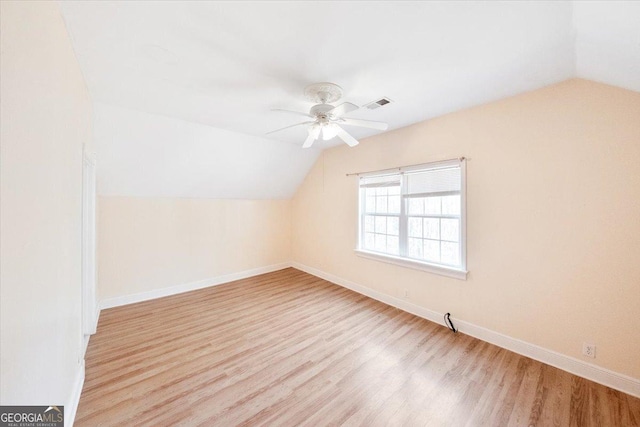 bonus room featuring light hardwood / wood-style floors, ceiling fan, and lofted ceiling