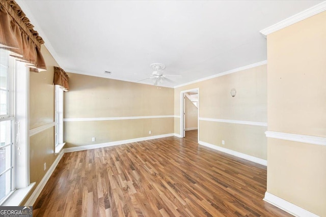 unfurnished room with hardwood / wood-style floors, ceiling fan, plenty of natural light, and ornamental molding