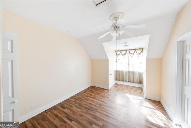 additional living space featuring hardwood / wood-style flooring, ceiling fan, and vaulted ceiling