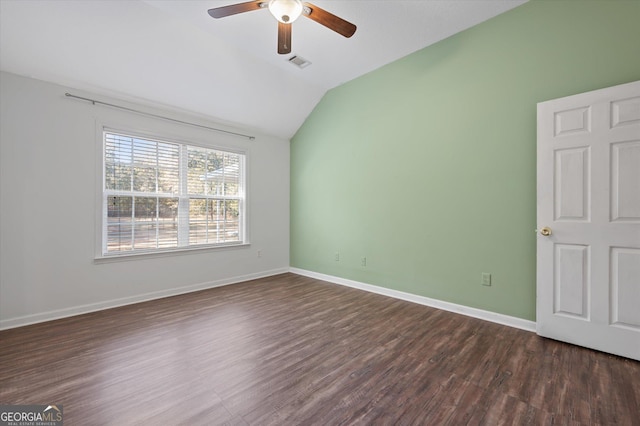 unfurnished room featuring ceiling fan, vaulted ceiling, and dark hardwood / wood-style flooring