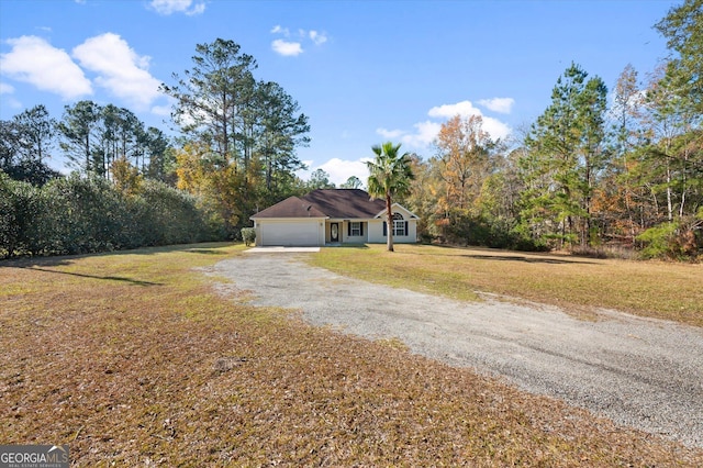 single story home featuring a front yard and a garage