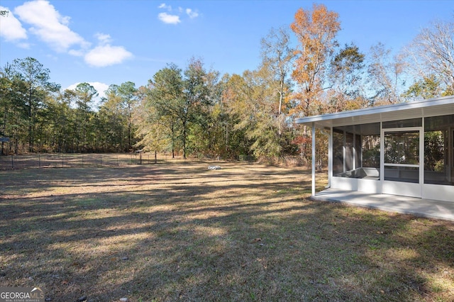 view of yard featuring a sunroom