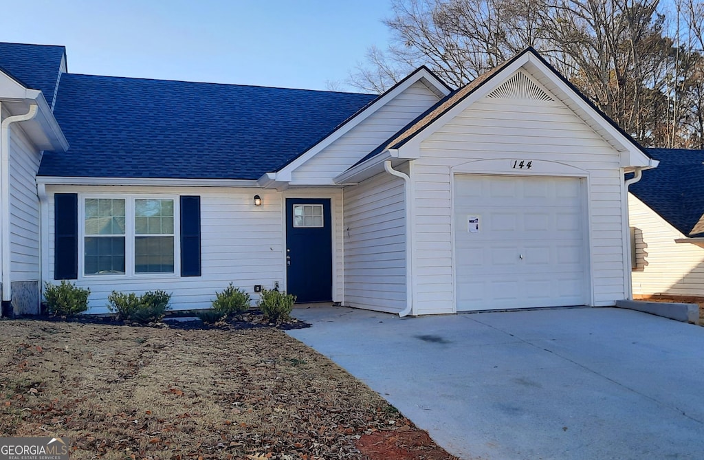 single story home with a garage