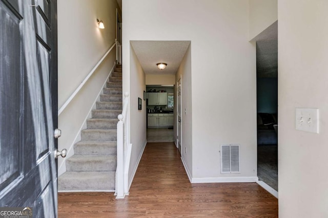 foyer featuring dark hardwood / wood-style floors