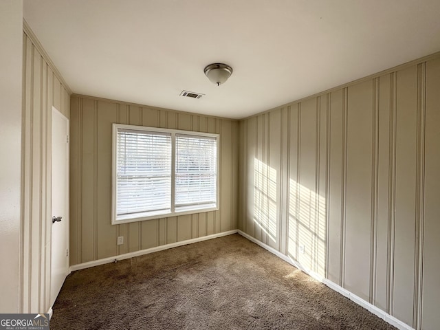 spare room featuring carpet flooring