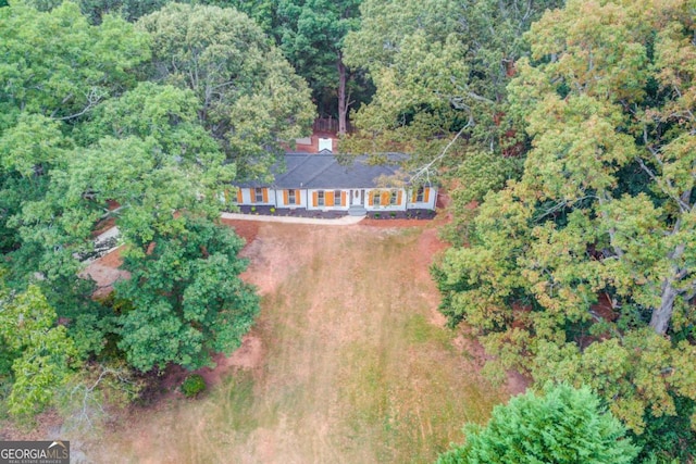 drone / aerial view with a view of trees