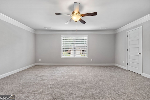 unfurnished room with crown molding, carpet, and ceiling fan