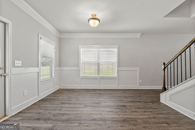 foyer with crown molding and dark hardwood / wood-style flooring