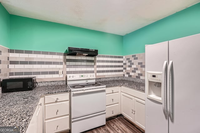 kitchen with white cabinetry, dark hardwood / wood-style flooring, range hood, white appliances, and decorative backsplash