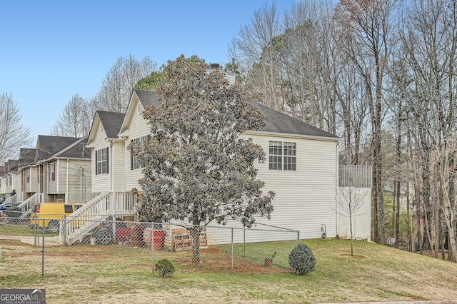 view of home's exterior featuring a yard