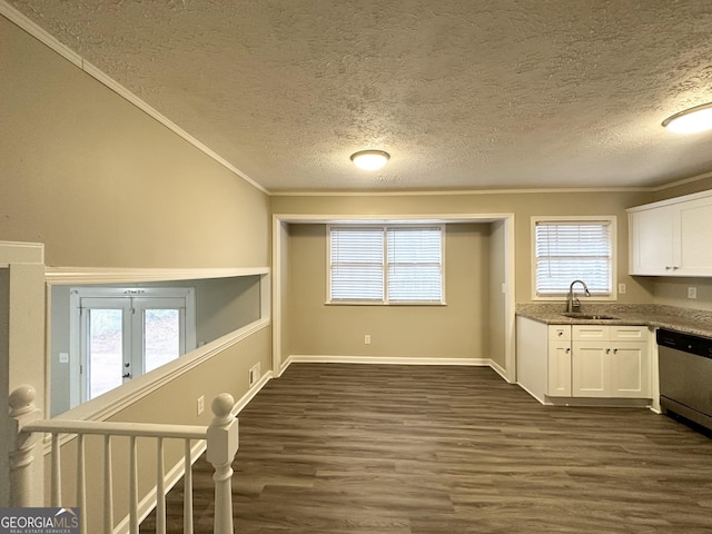 kitchen featuring dark hardwood / wood-style flooring, dishwasher, white cabinets, and sink