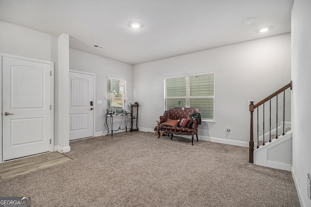 sitting room featuring carpet flooring