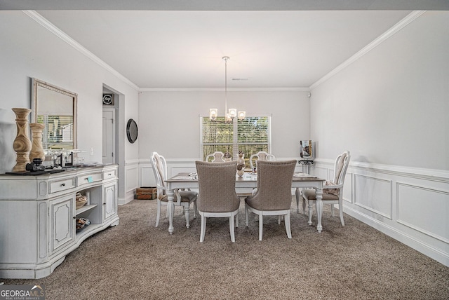 dining area featuring carpet flooring, an inviting chandelier, and ornamental molding