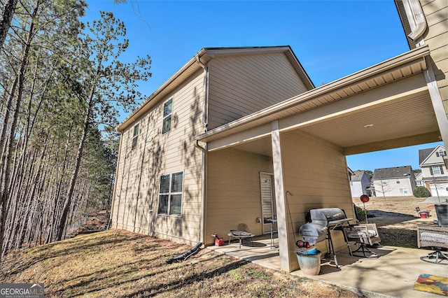 view of home's exterior with a patio