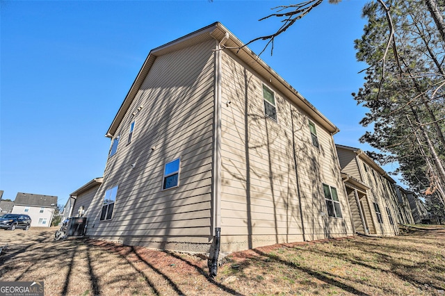 view of side of property with a yard