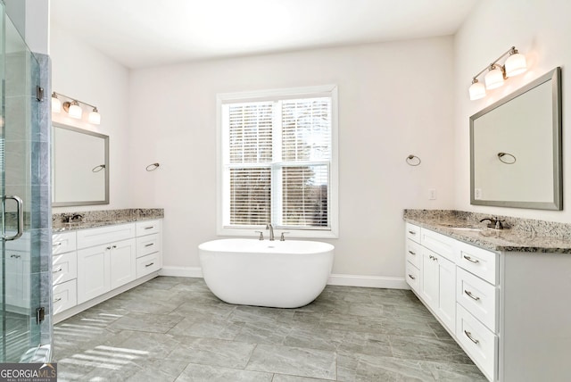bathroom featuring vanity and shower with separate bathtub