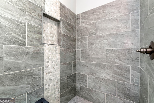 bathroom featuring tiled shower