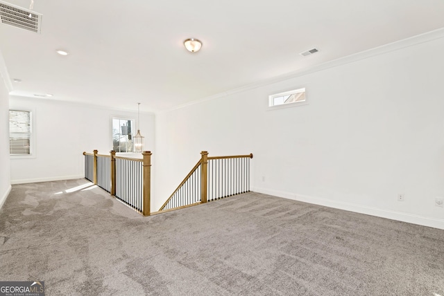 carpeted empty room with ornamental molding