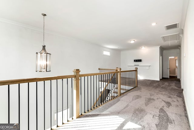 hall with carpet flooring and ornamental molding