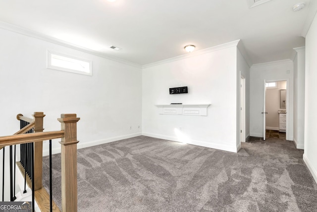 unfurnished living room with carpet floors and crown molding
