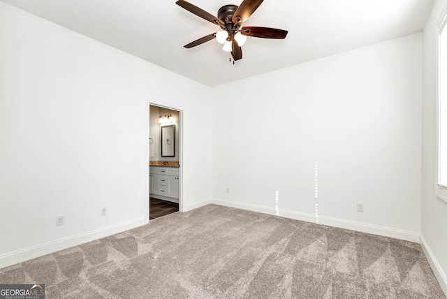 carpeted empty room with ceiling fan