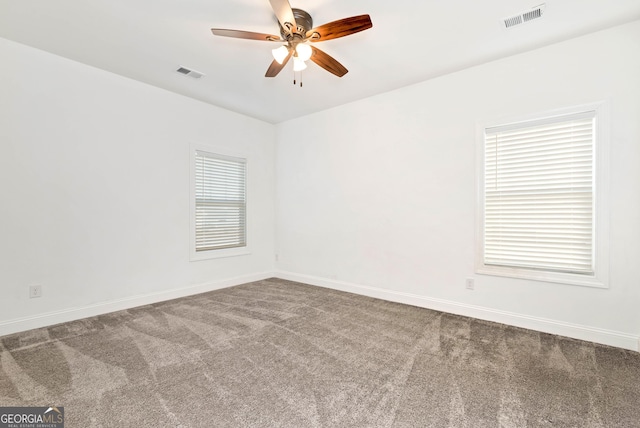 unfurnished room featuring carpet floors and ceiling fan