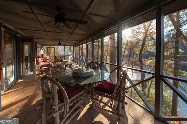 sunroom / solarium featuring ceiling fan