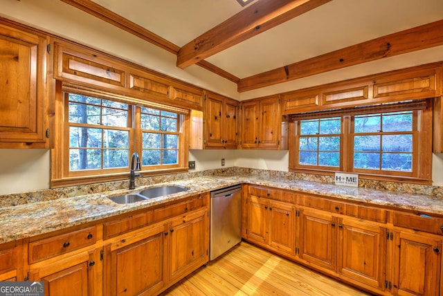 kitchen with beam ceiling, dishwasher, sink, light stone counters, and light hardwood / wood-style floors