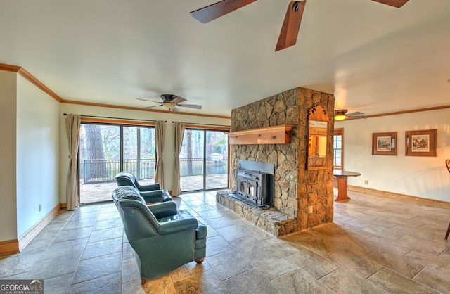 living room featuring ceiling fan, a wood stove, and crown molding