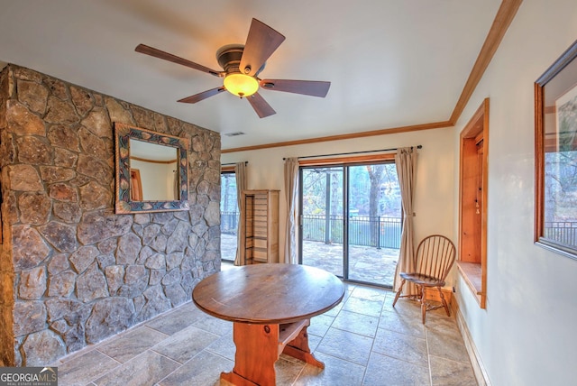 dining room with ceiling fan and ornamental molding