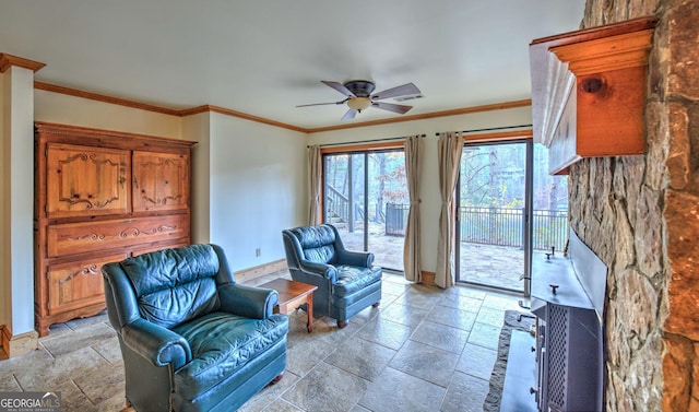 interior space with ceiling fan and crown molding