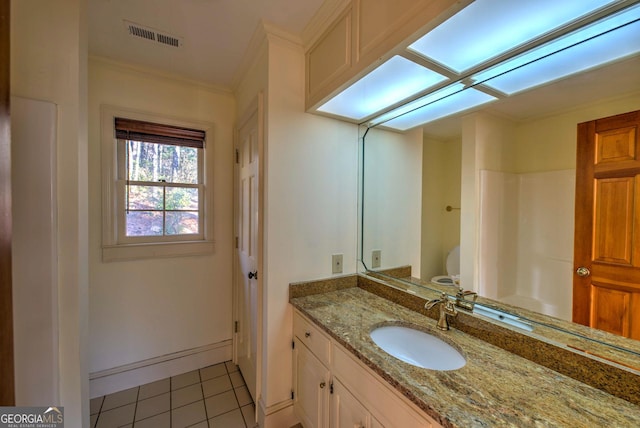 bathroom featuring walk in shower, vanity, crown molding, tile patterned flooring, and toilet