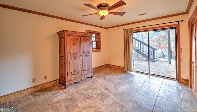 unfurnished room featuring ceiling fan and ornamental molding