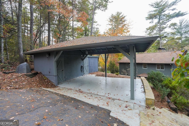 view of parking / parking lot featuring a carport