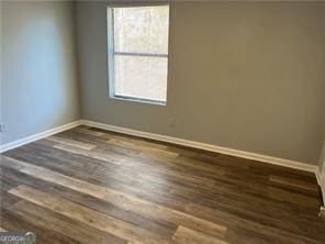 empty room featuring dark hardwood / wood-style floors