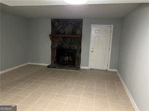 unfurnished living room with a fireplace